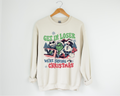 Cream crewneck sweatshirt with colorful cartoon Christmas graphic on front