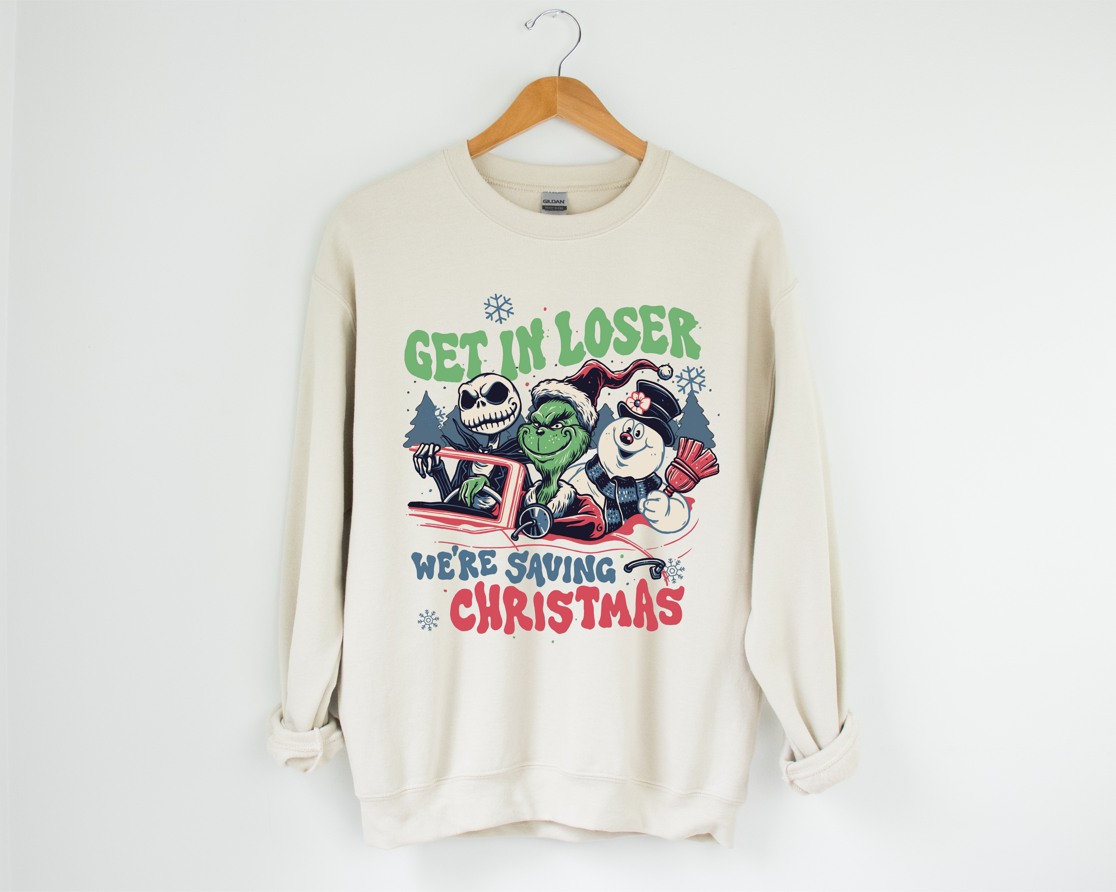 Cream crewneck sweatshirt with colorful cartoon Christmas graphic on front