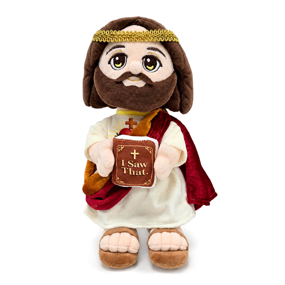 Plush Jesus toy front view, white robe and red cape, holding “I Saw That” book.