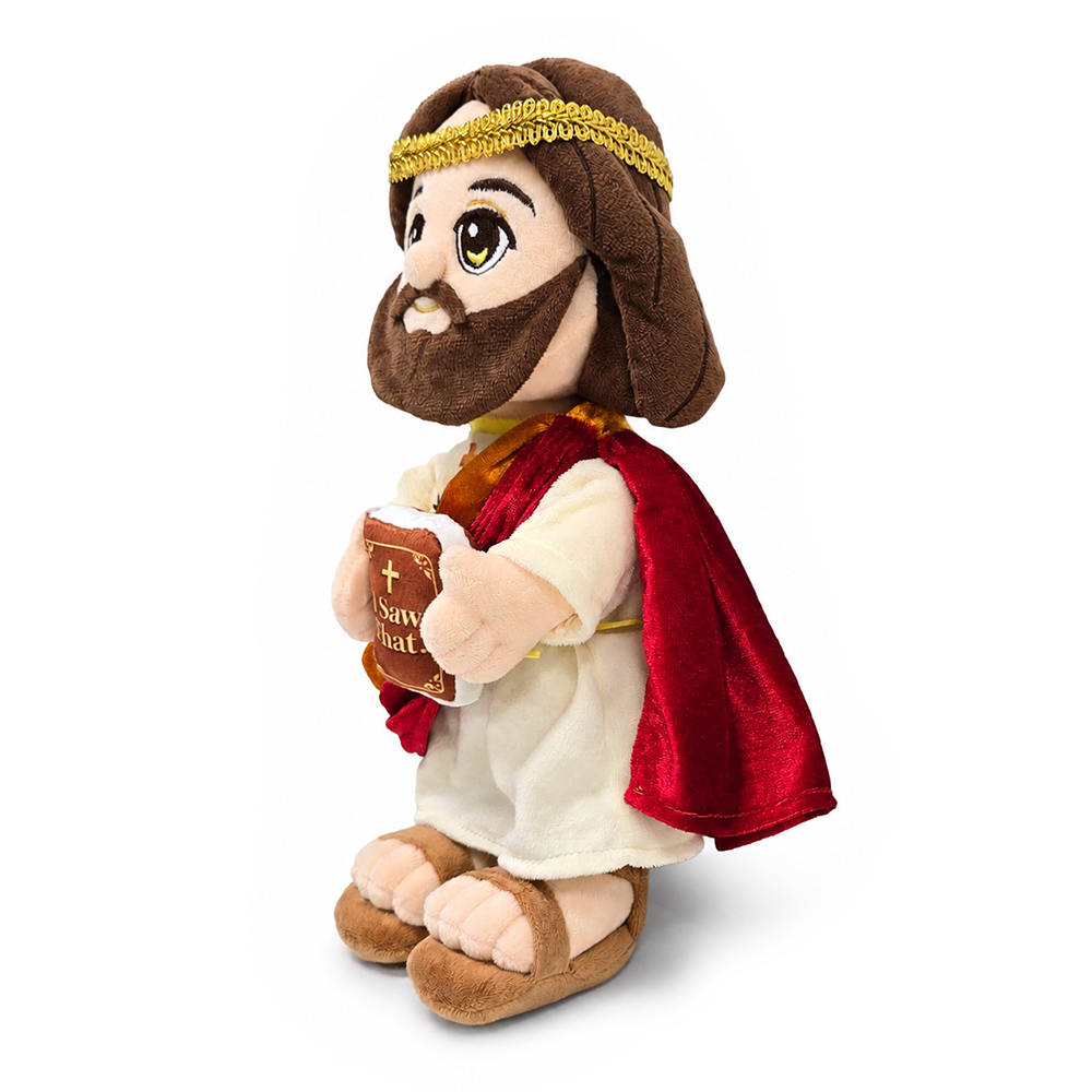 Plush Jesus toy 3/4 side view, white robe and red cape, holding “I Saw That” book.