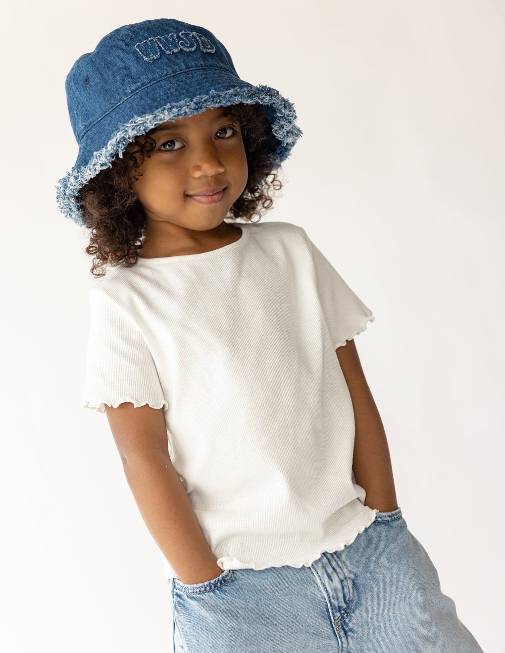 Denim bucket hat with embroidered WWJD logo, frayed brim and soft crown, blue