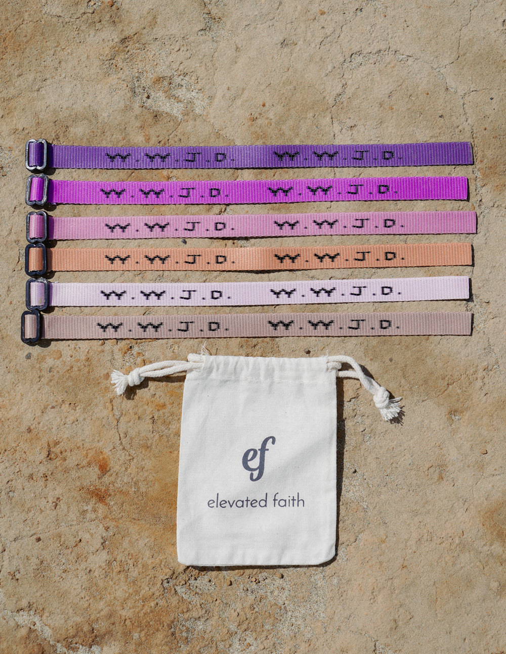 Set of five WWJD woven adjustable bracelets, purple orange white black tones, with clasp