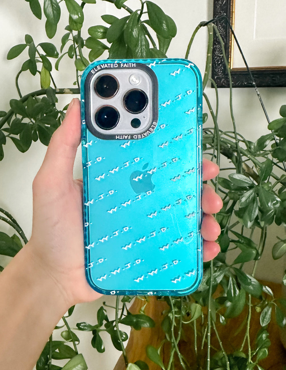Blue phone case with repeating white WWJD pattern and raised camera cutouts