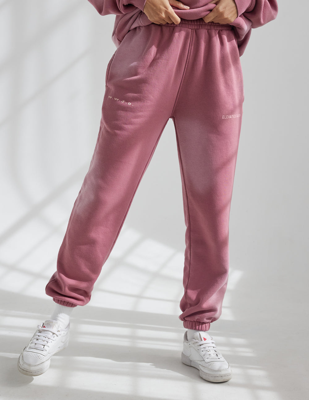 Pink jogger sweatpants with tapered legs and elastic cuffs