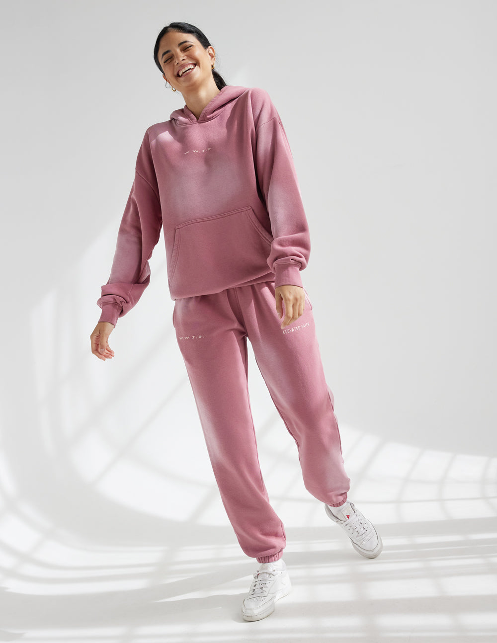 Pink unisex sweatpants with relaxed fit and elastic ankle cuffs