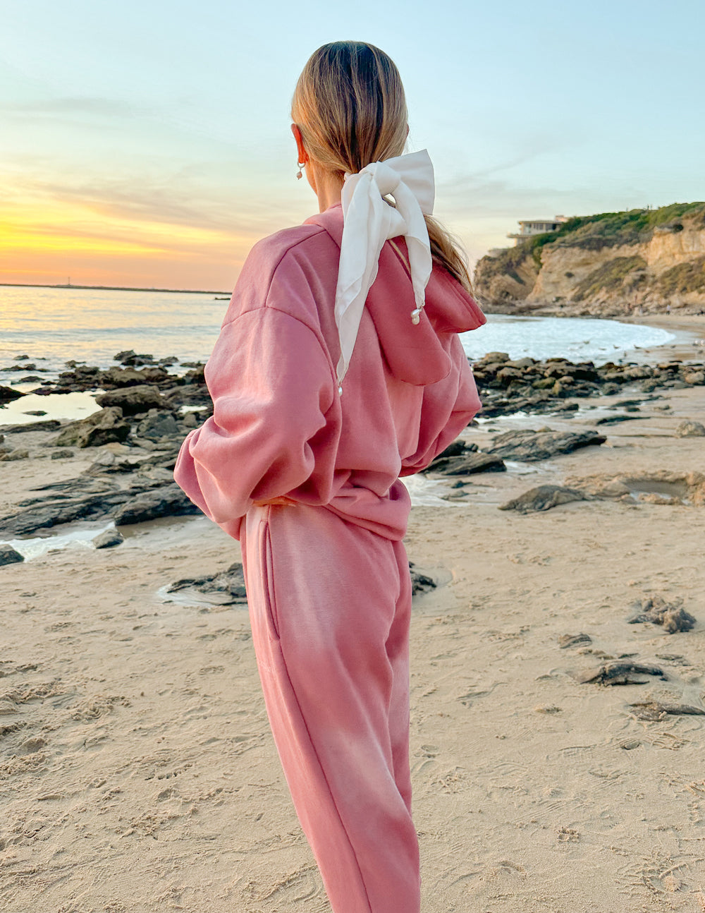 Pink sweatpants back view with elastic ankle cuffs