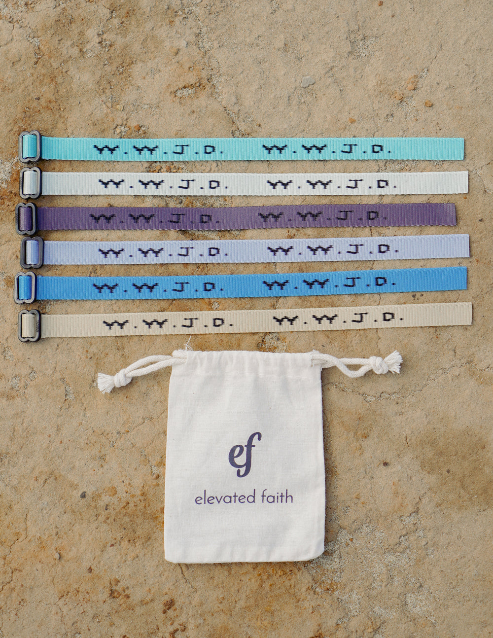 WWJD bracelet set with light blue, white, purple, and dark blue bands plus pouch bag