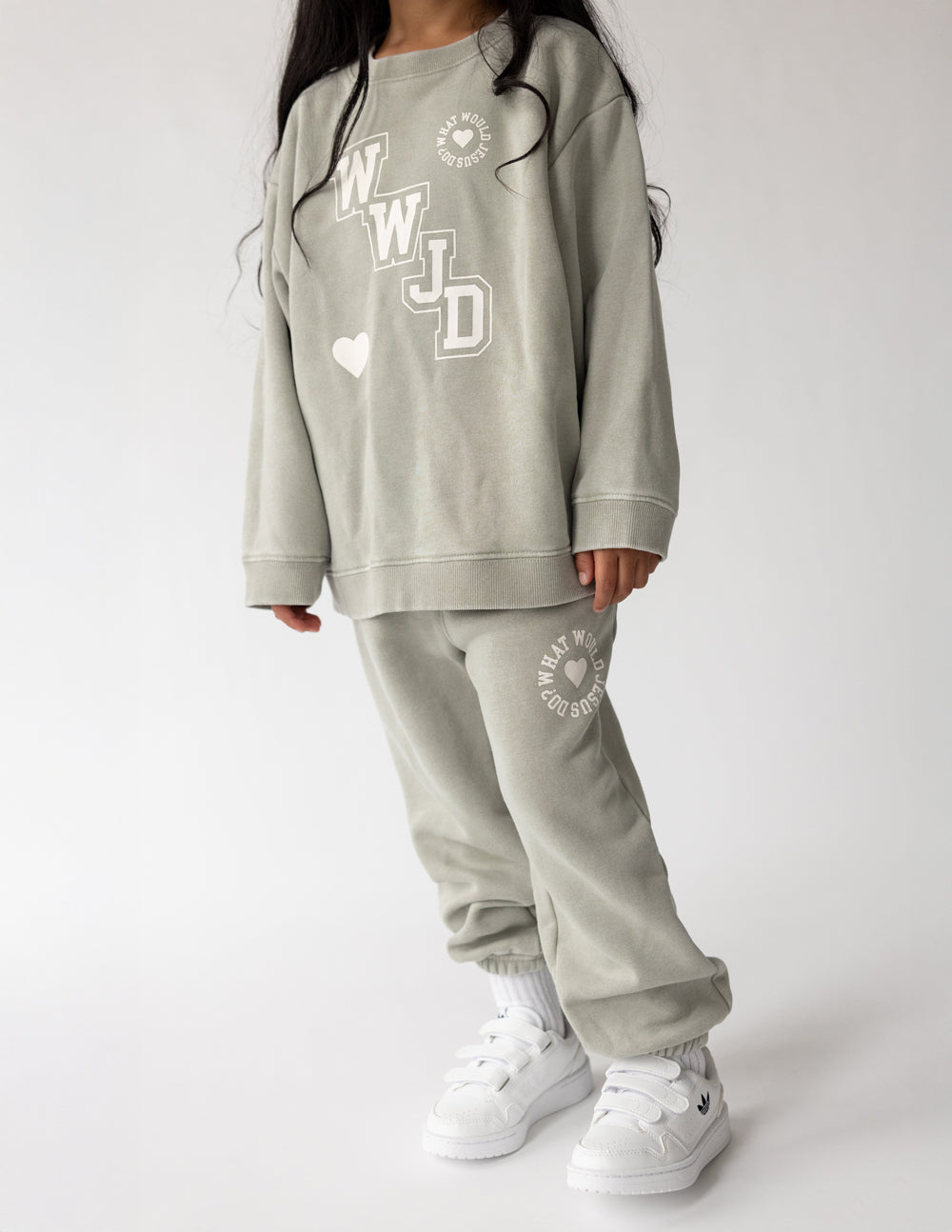 Kids varsity crewneck sweatshirt in light gray with WJD graphic and heart accents