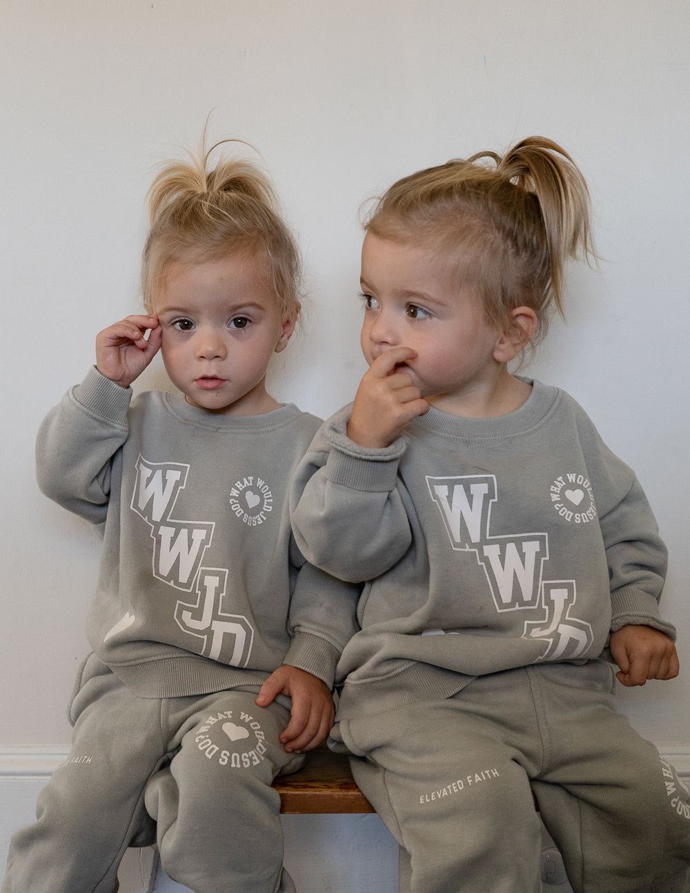 Kids varsity crewneck sweatshirt set in light gray with WJD logo on front