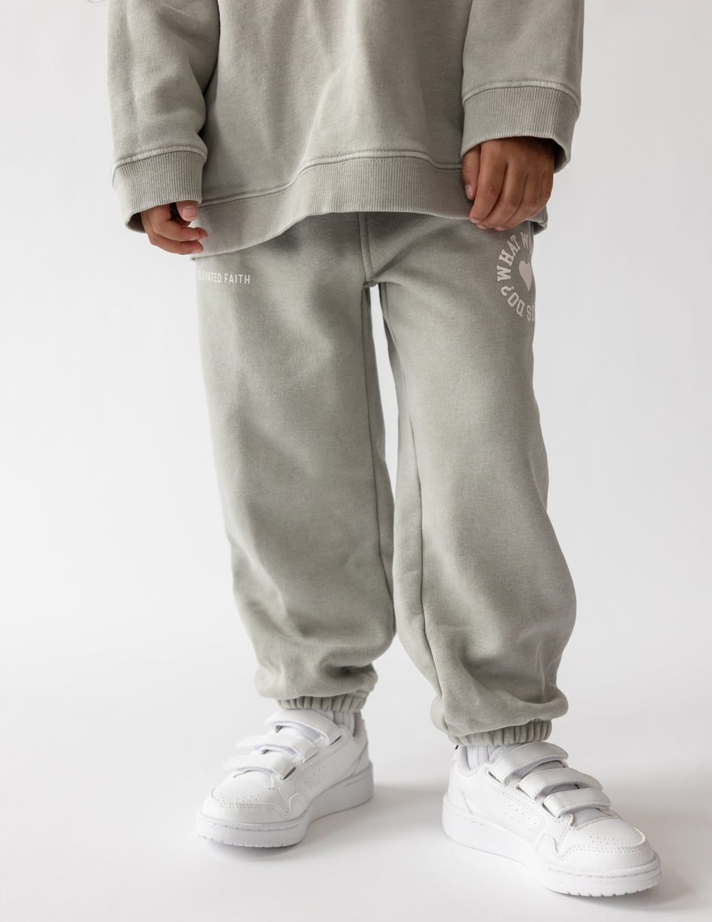 Light gray kids sweatpants with heart logo prints at sides and elastic cuffs