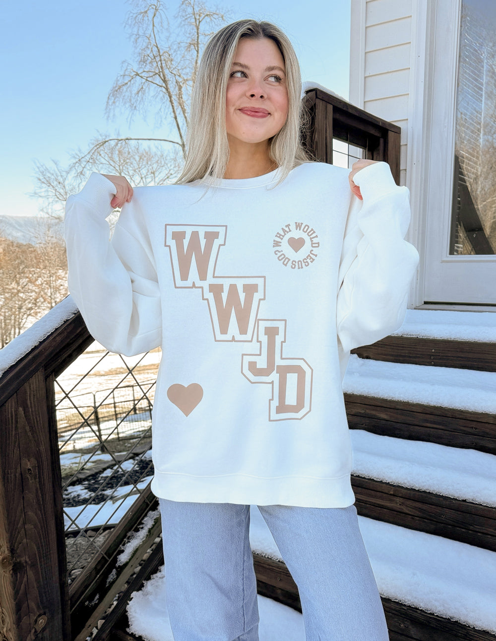 Off-white unisex crewneck sweatshirt with WWJD varsity print and heart at center