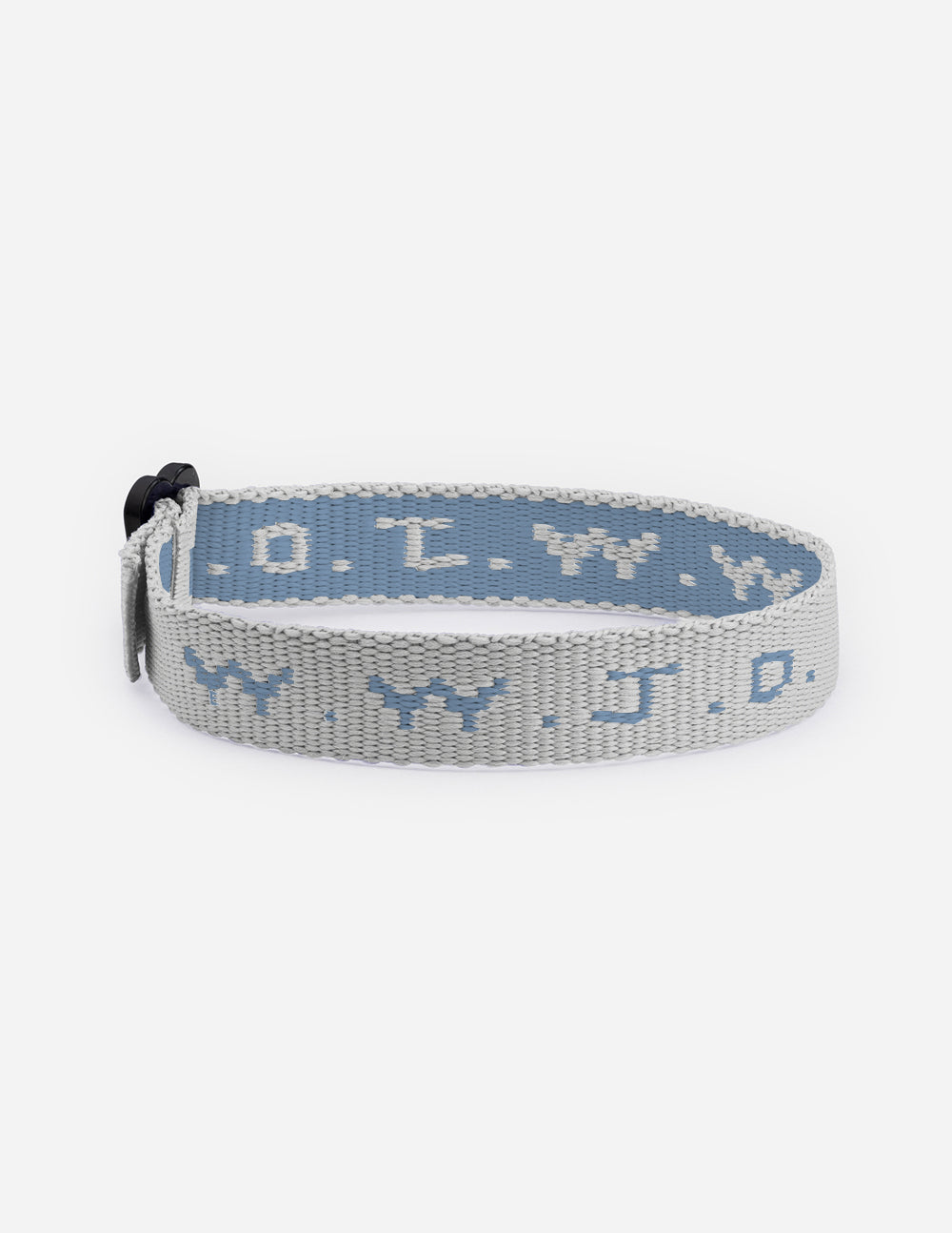 Gray woven cyber charm bracelet with repeating symbols and knotted strap end.