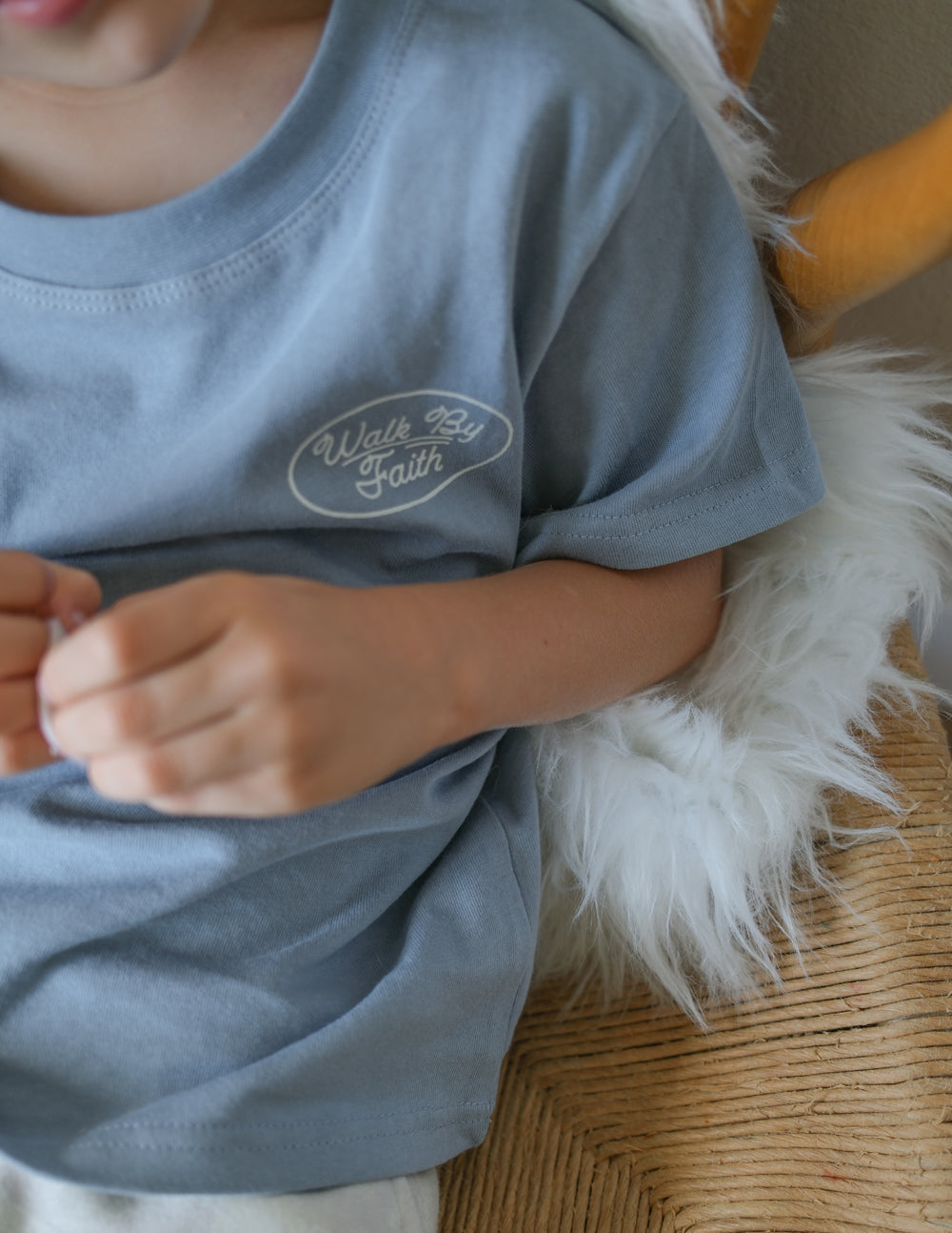 Light blue kids T-shirt with small "Walk by Faith" chest logo