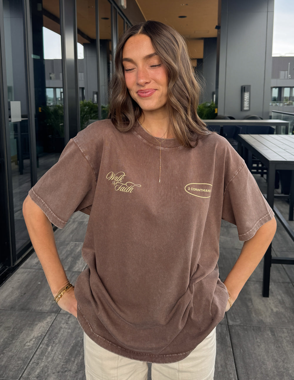 Brown unisex crewneck T-shirt with 'Walk by Faith' logo and '2 Corinthians 5:7' oval.