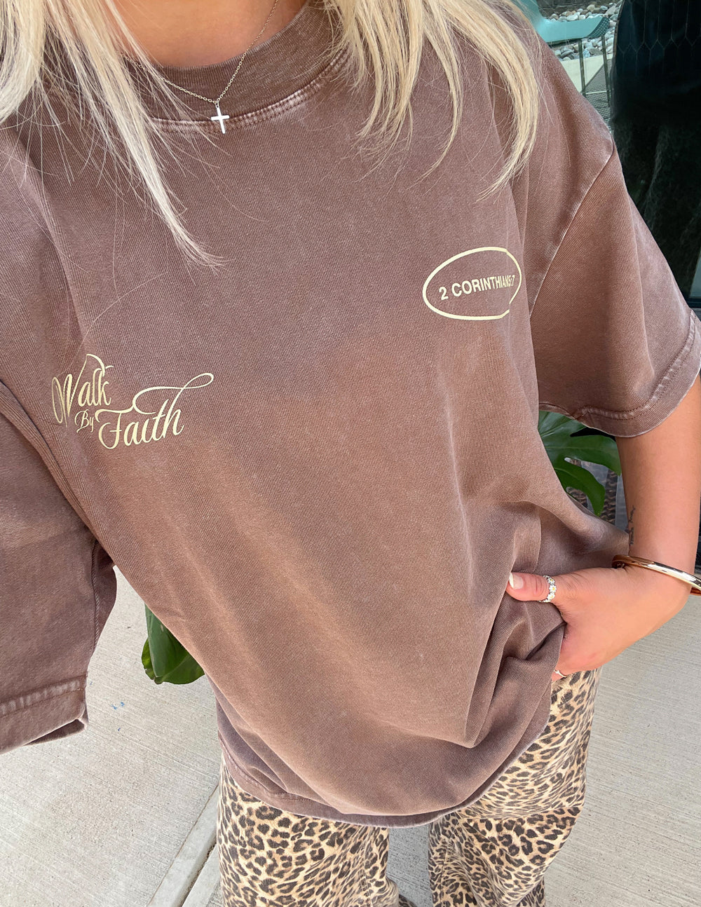Brown unisex crewneck T-shirt with 'Walk by Faith' and '2 Corinthians 5:7' prints.
