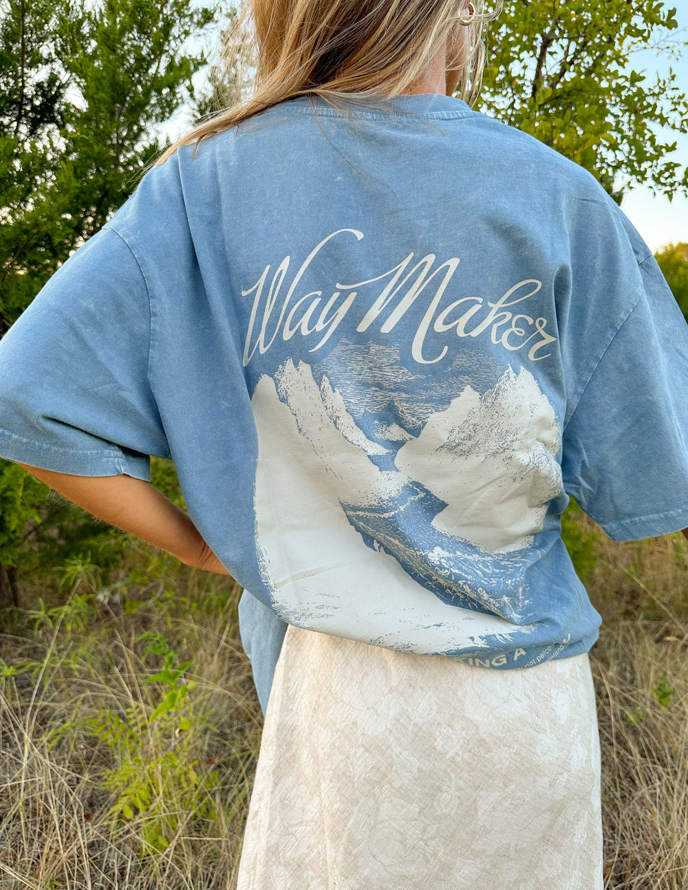 Unisex blue Way Maker T-shirt close-up of back graphic print and script logo.