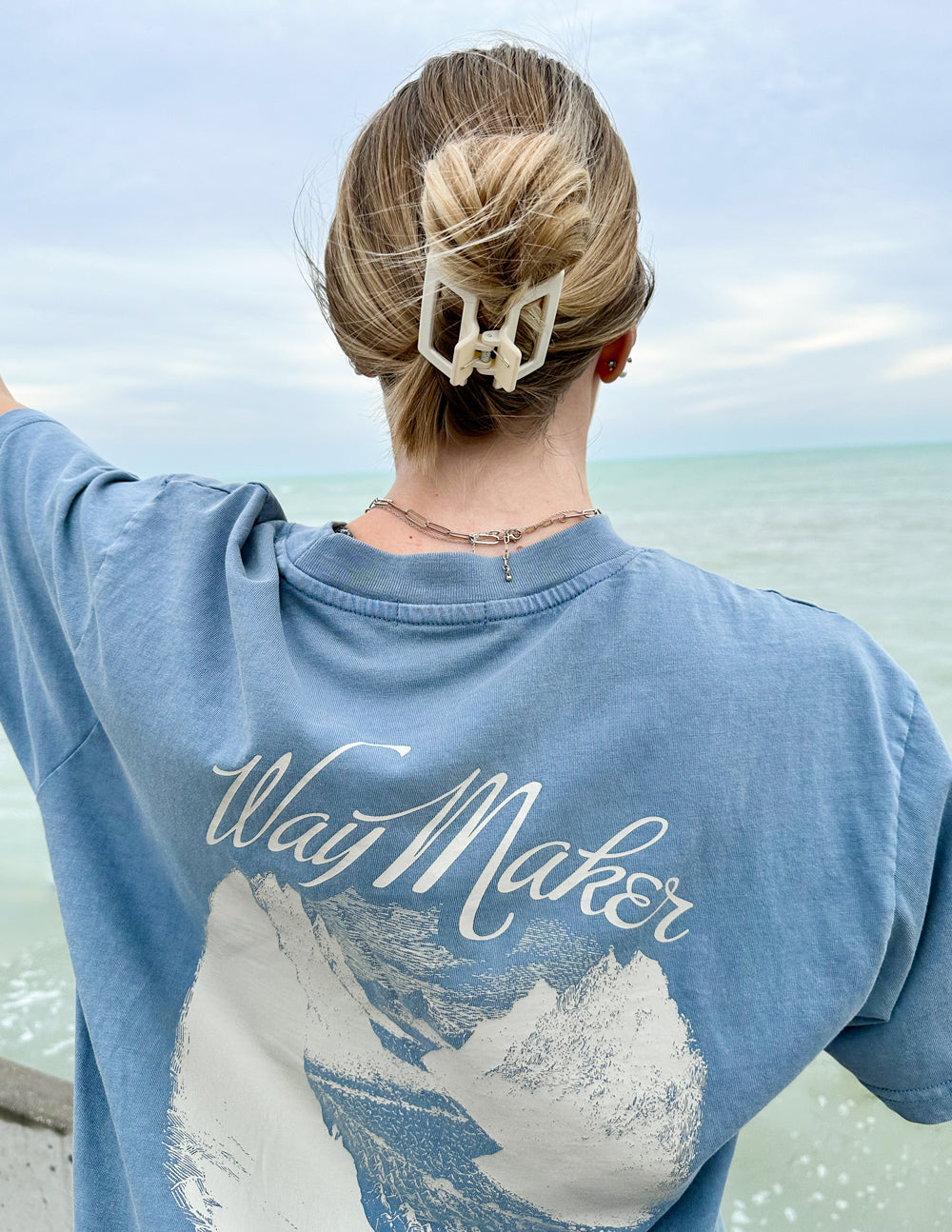Unisex blue Way Maker T-shirt back view with large script logo and mountain artwork.