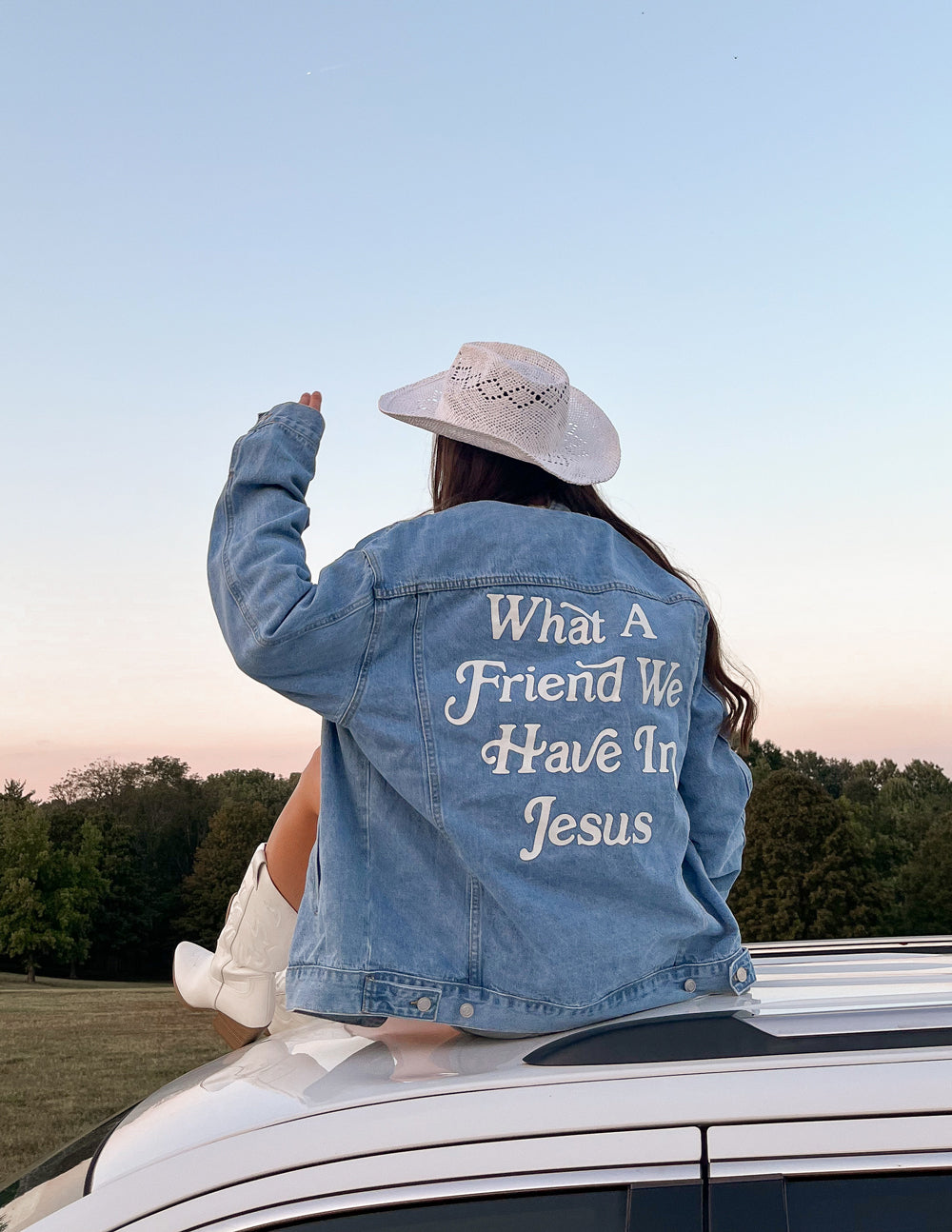 Light blue denim jacket with 'What A Friend We Have In Jesus' back graphic and front pockets