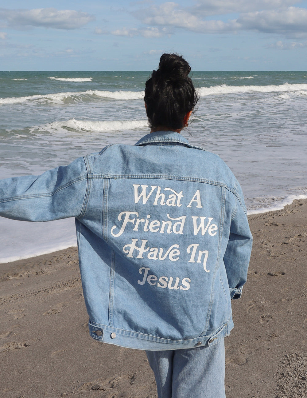 Light blue denim jacket with 'What A Friend We Have In Jesus' back graphic and buttoned hem
