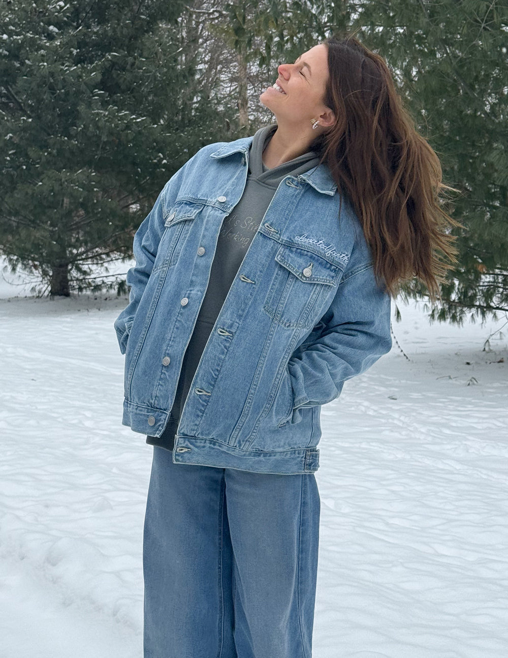 Light blue denim jacket with pointed collar and classic button front