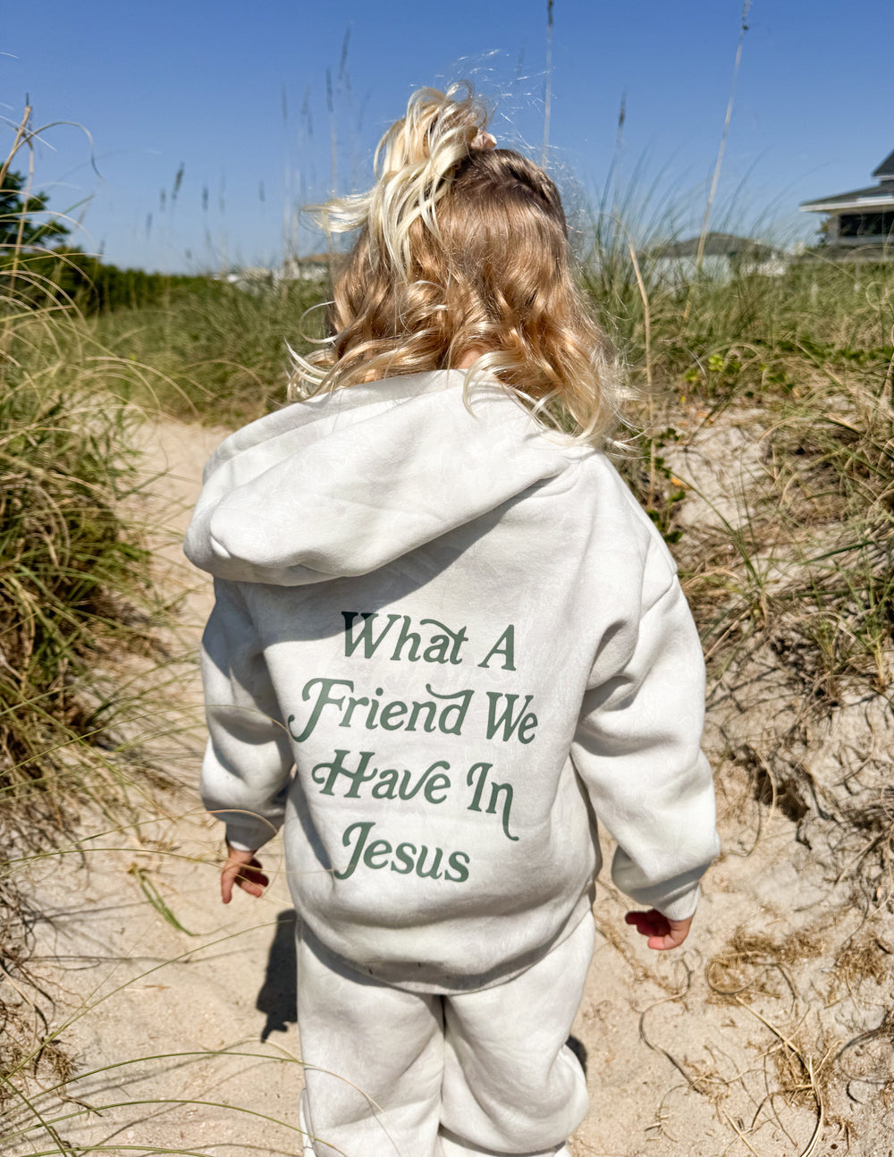 Kids pullover hoodie in light gray with back graphic “What A Friend We Have In Jesus”.