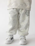 Kids sweatpants in light heather with elastic cuffs and front logo print