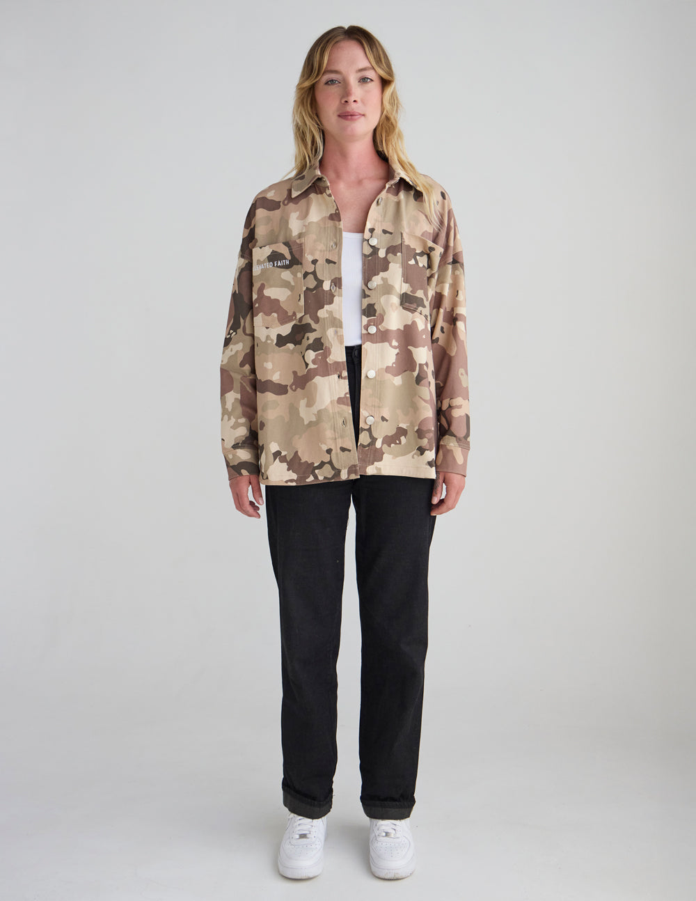 Camouflage shacket jacket front view, button-up with chest pockets.