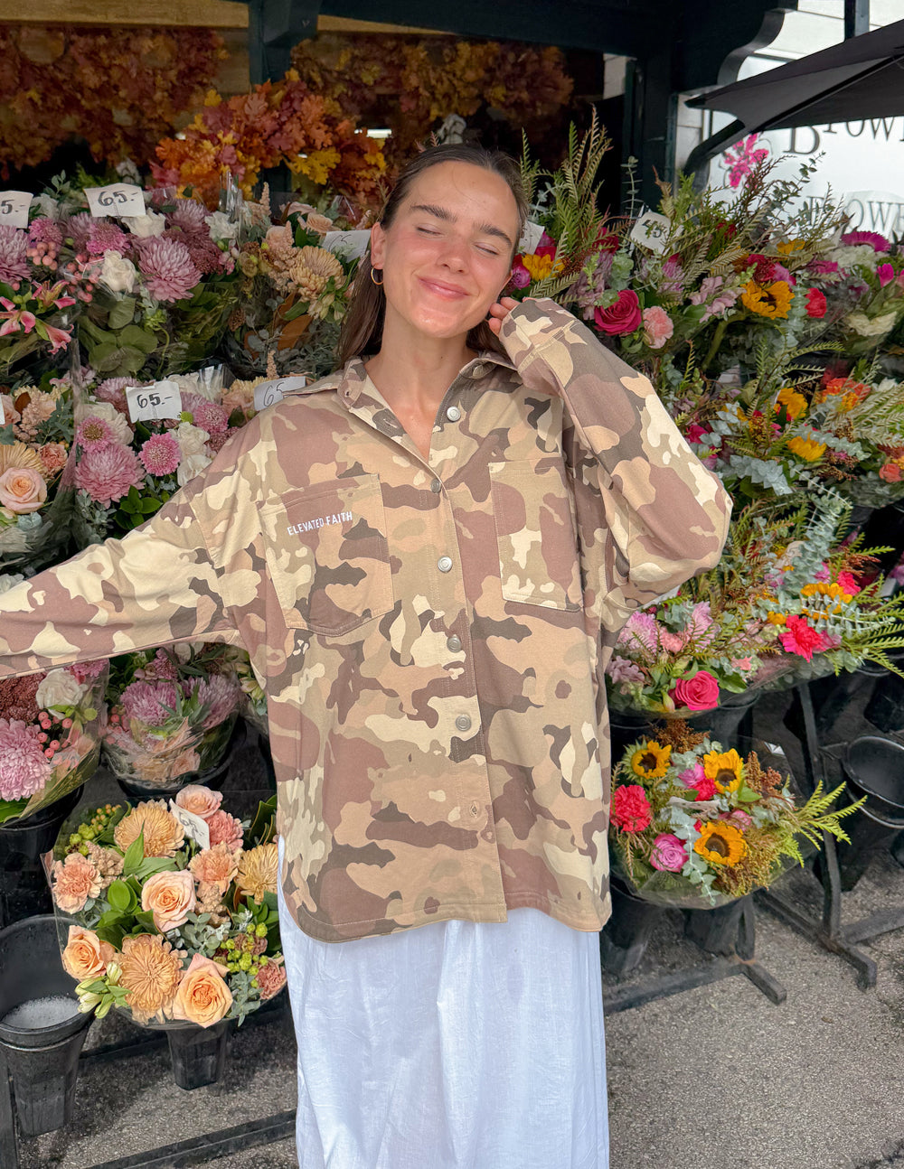 Camouflage shacket jacket front view with “Elevated Faith” chest text.