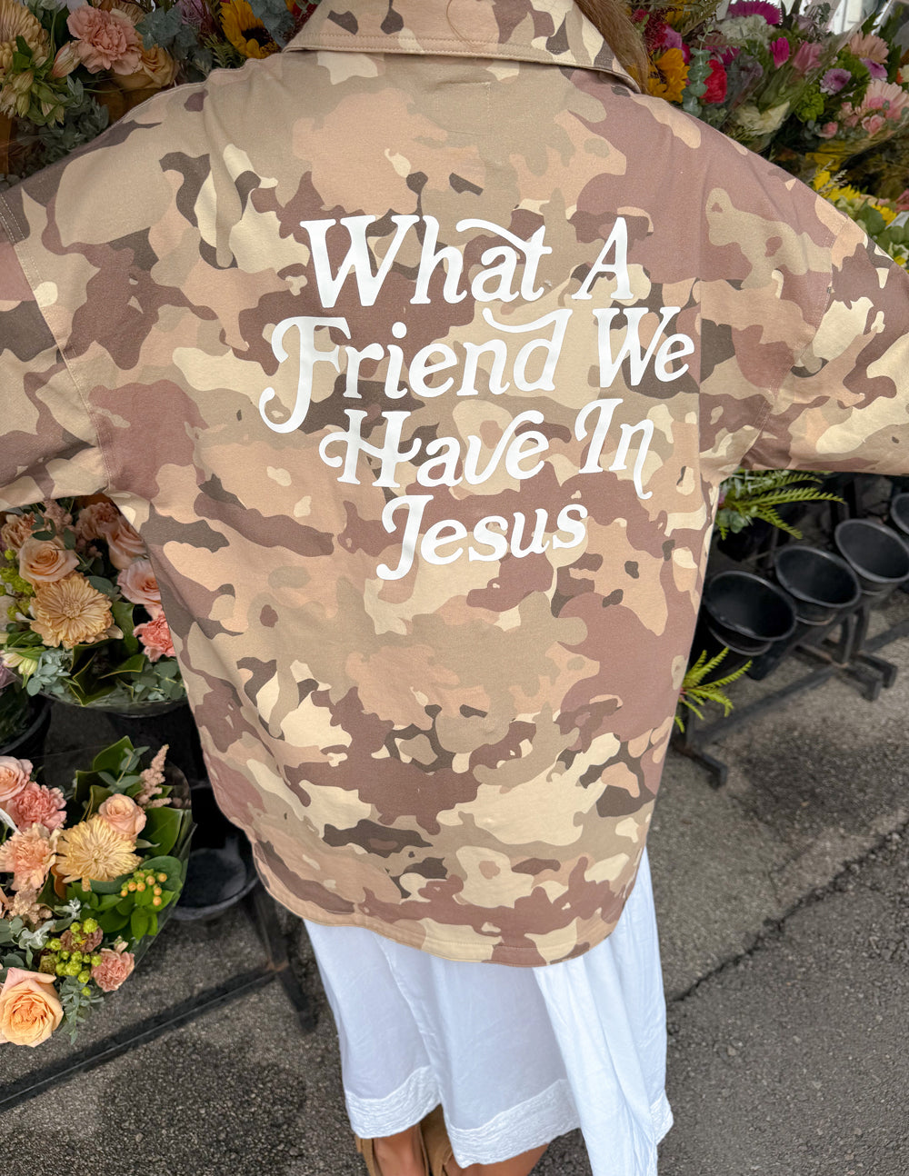 Camo shacket with large back text graphic, taupe and brown camouflage pattern