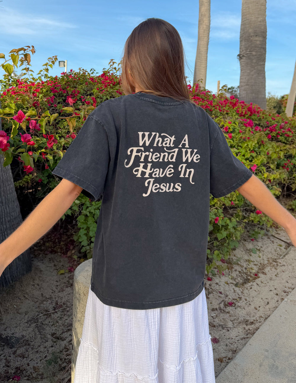 Black heavyweight T-shirt with large back text "What A Friend We Have In Jesus"