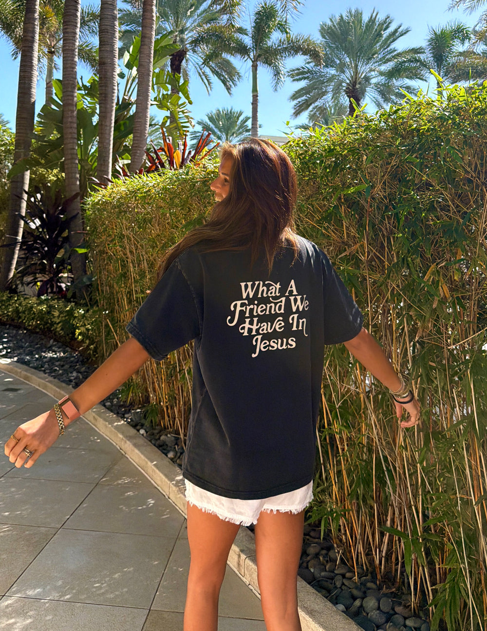 Black heavyweight T-shirt with large back text "What A Friend We Have In Jesus"