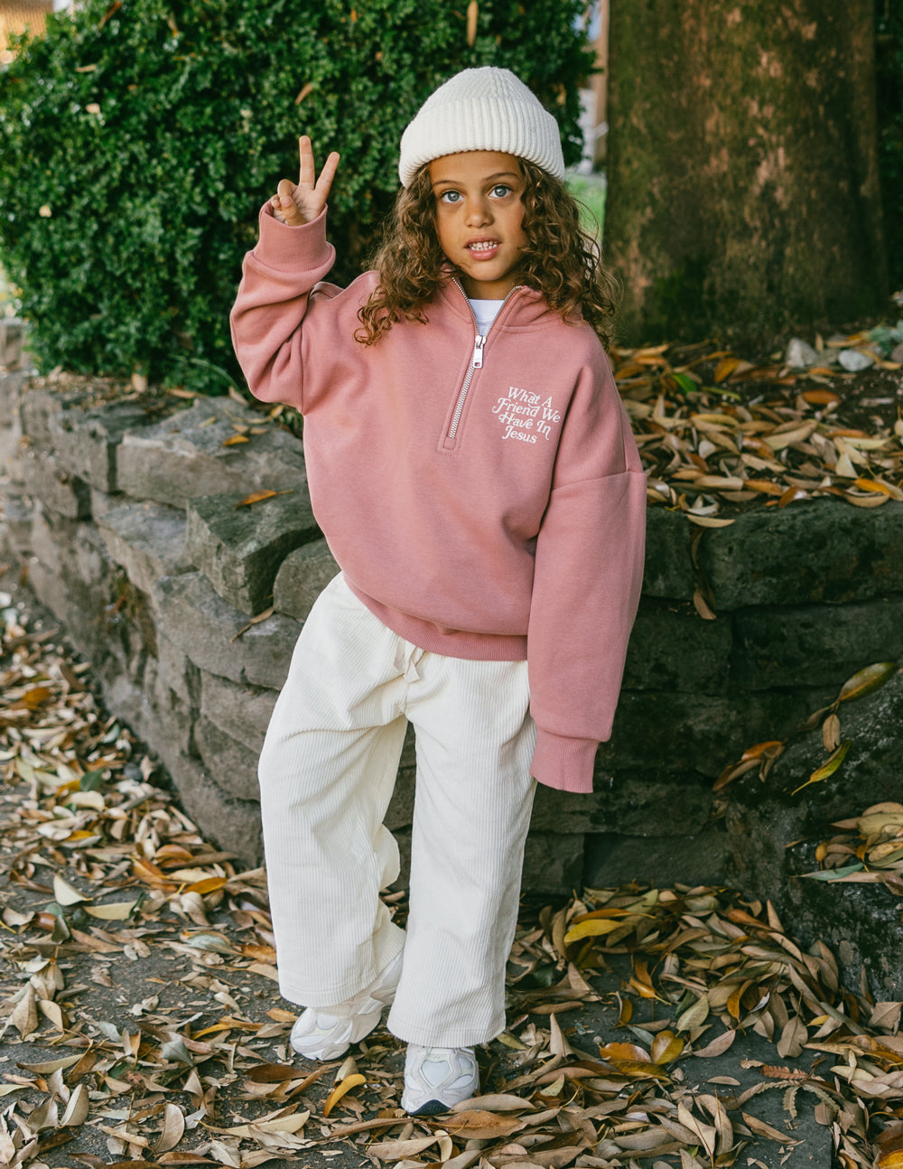 Kids mauve half-zip sweatshirt with stand collar and embroidered chest text
