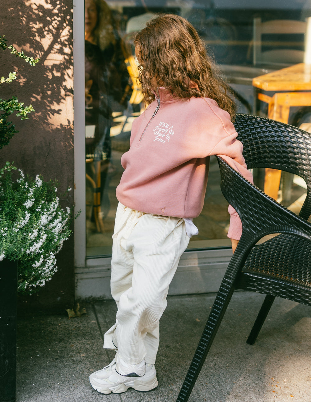 Kids mauve half-zip sweatshirt, rear view with ribbed cuffs and waistband