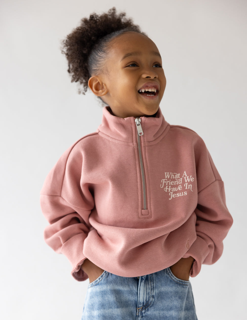 Kids mauve half-zip sweatshirt with zip pull tab and embroidered chest lettering