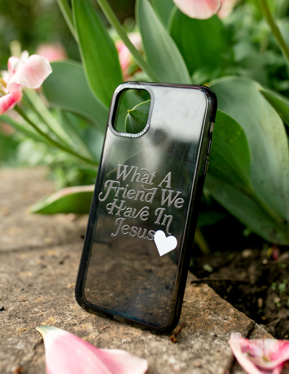 Phone case with 'What A Friend We Have In Jesus' text and white heart, clear back