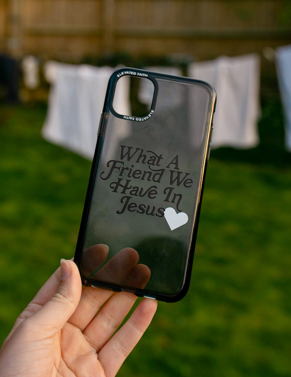 Phone case with 'What A Friend We Have In Jesus' text and white heart, glossy back