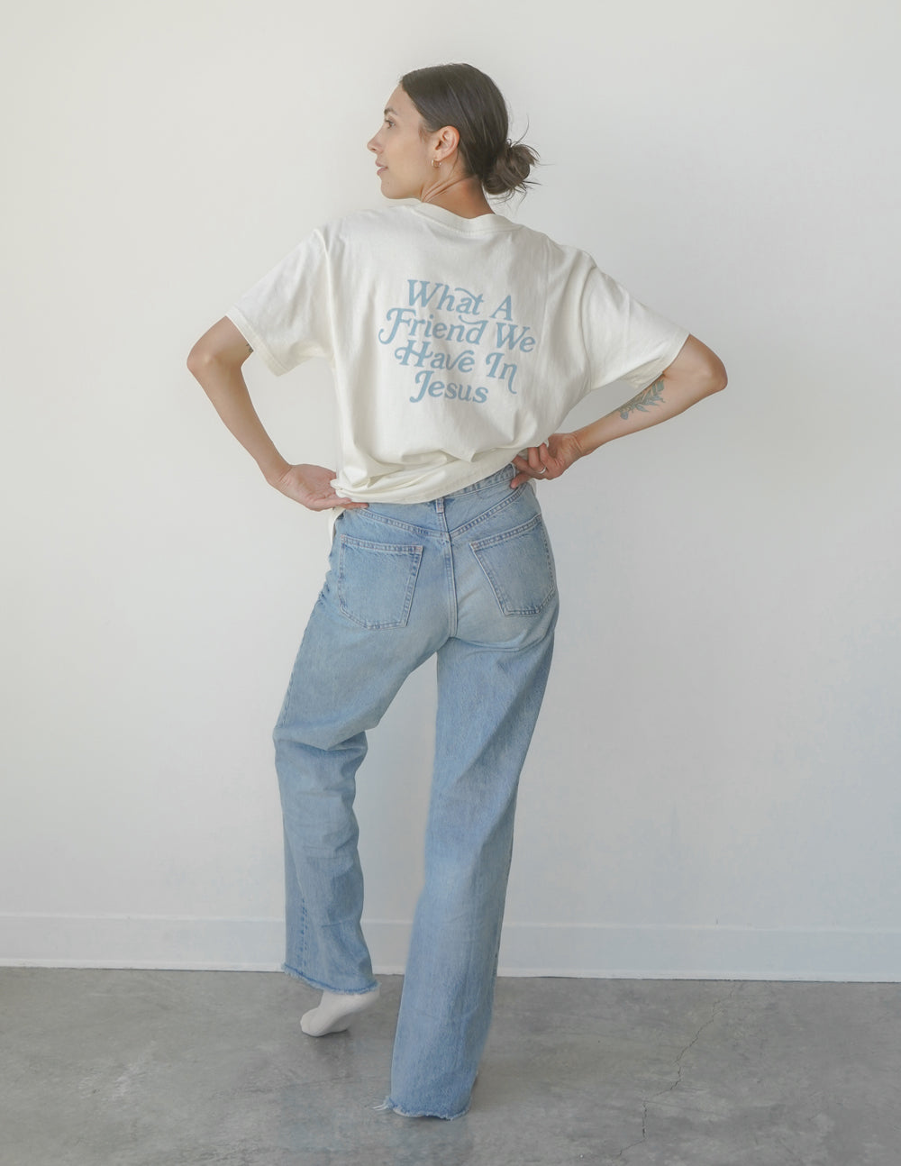 White unisex crew-neck tee with 'Jesus Friend' text graphic on front.