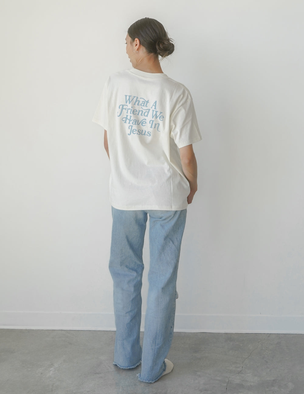 White unisex tee with 'What A Friend We Have In Jesus' text on back, crew neck.