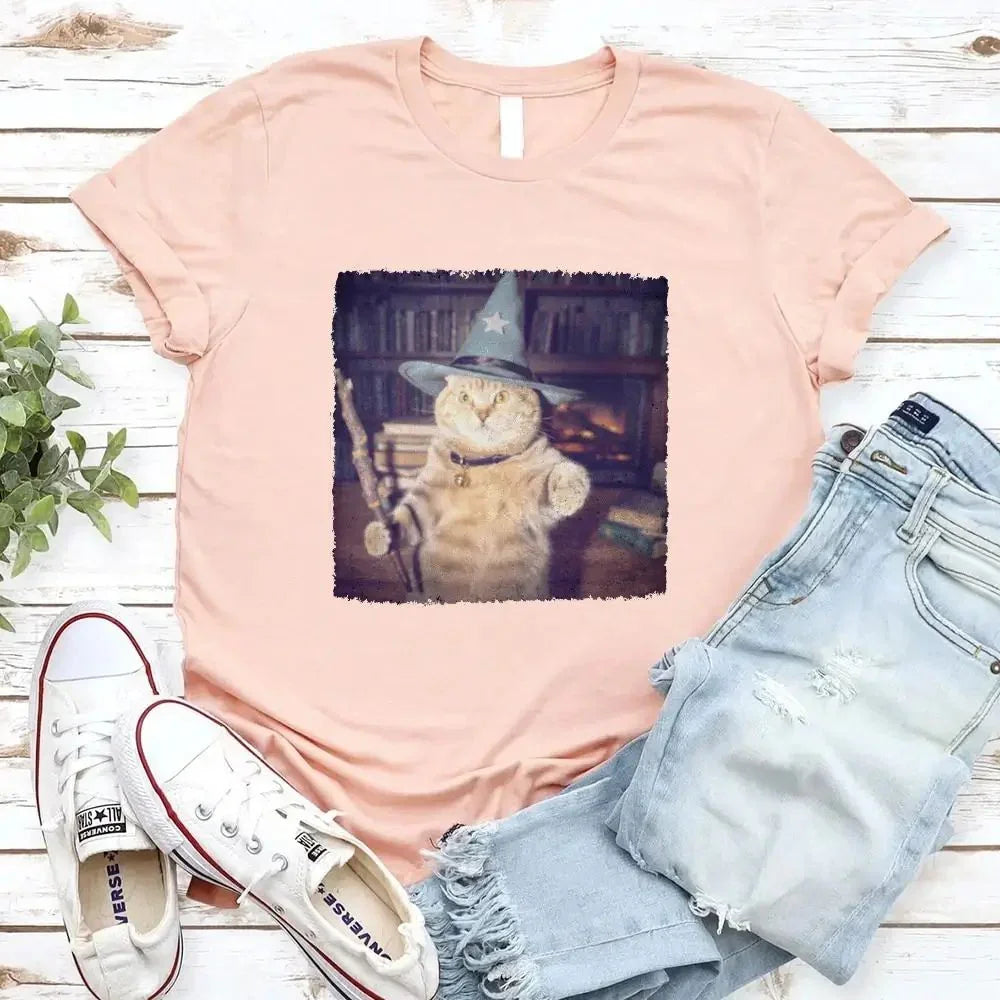 Peach Halloween cat graphic t-shirt with wizard-hat cat print