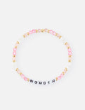 Letter bracelet with pink and gold beads and a WONDER charm at center