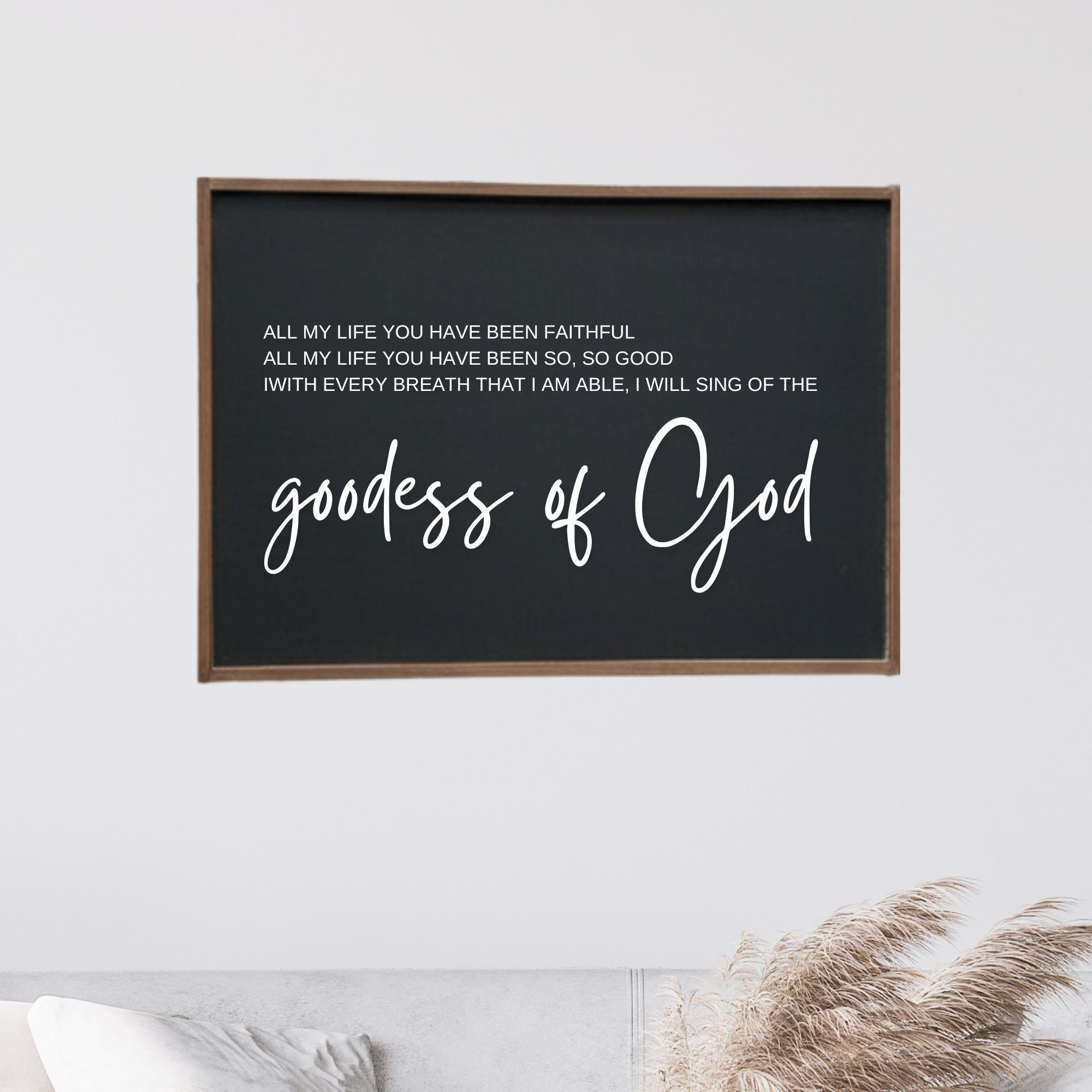 Framed wooden wall sign, dark panel, white script "goodness of God"