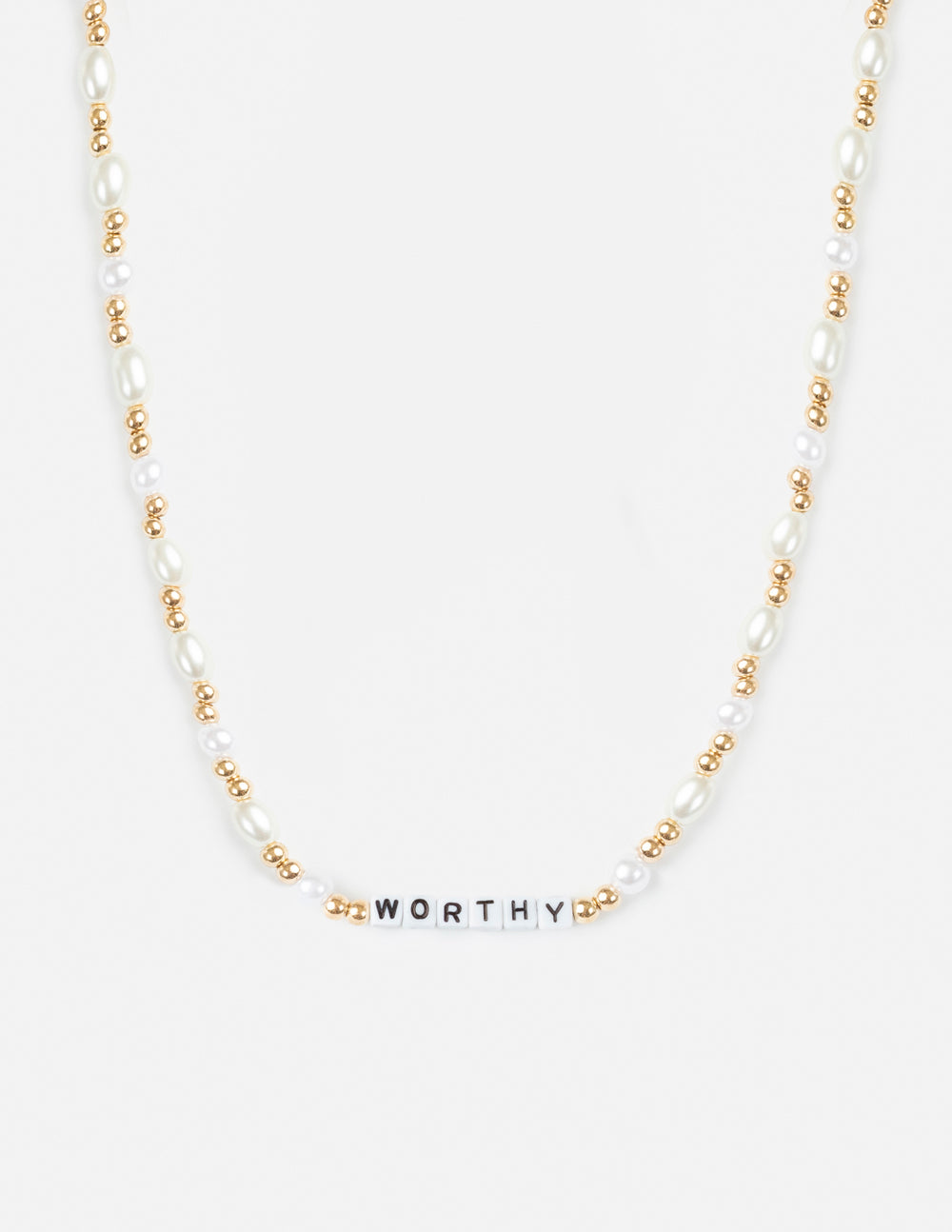 Letter necklace with gold-tone beads, white pearls, and 'WORTHY' bar pendant