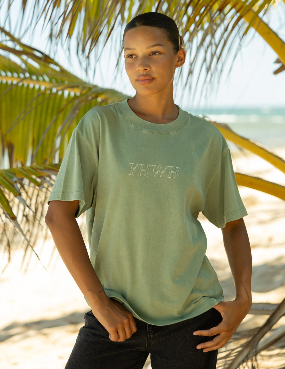 Unisex sage green T-shirt with printed YHWH logo on chest.