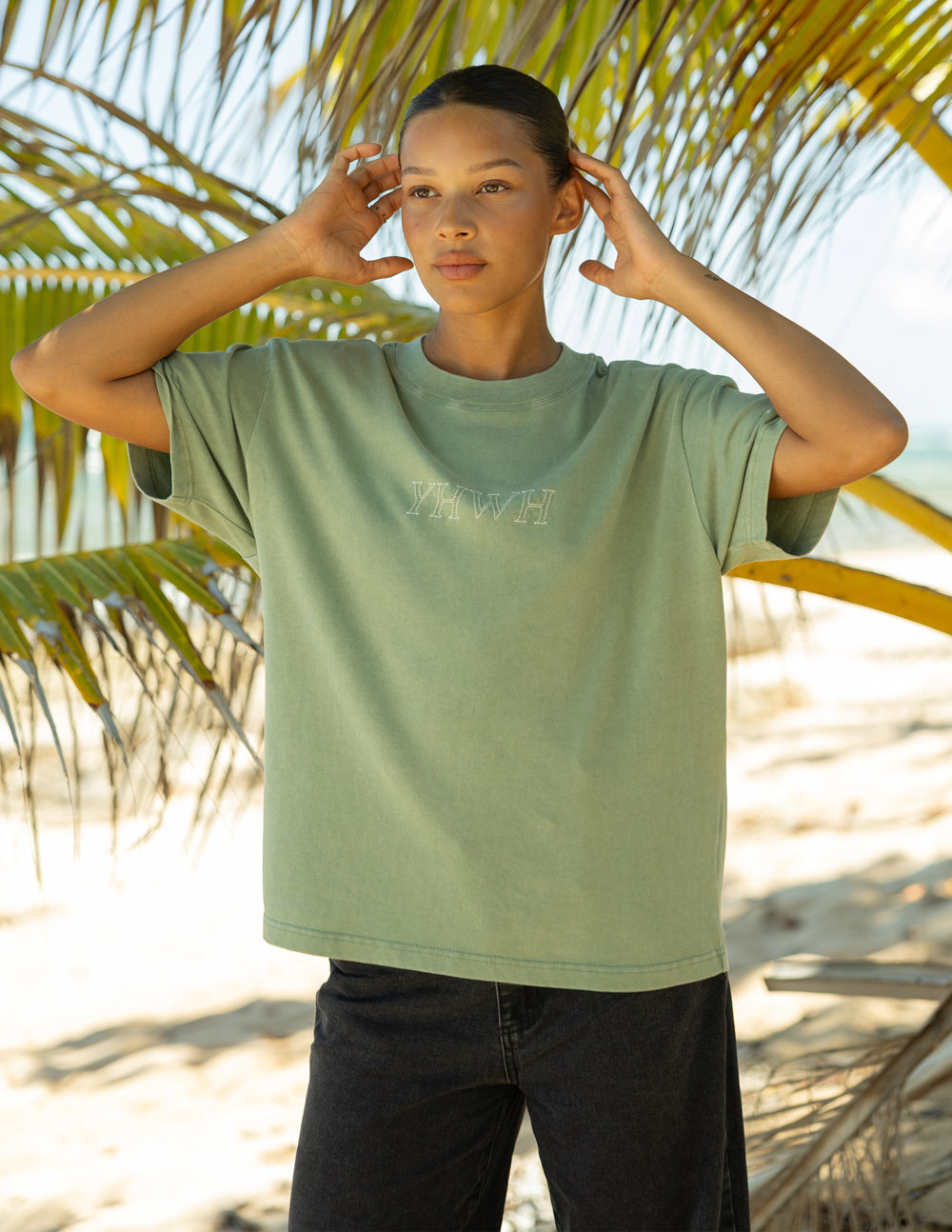 Unisex sage green T-shirt with YHWH logo on upper chest.