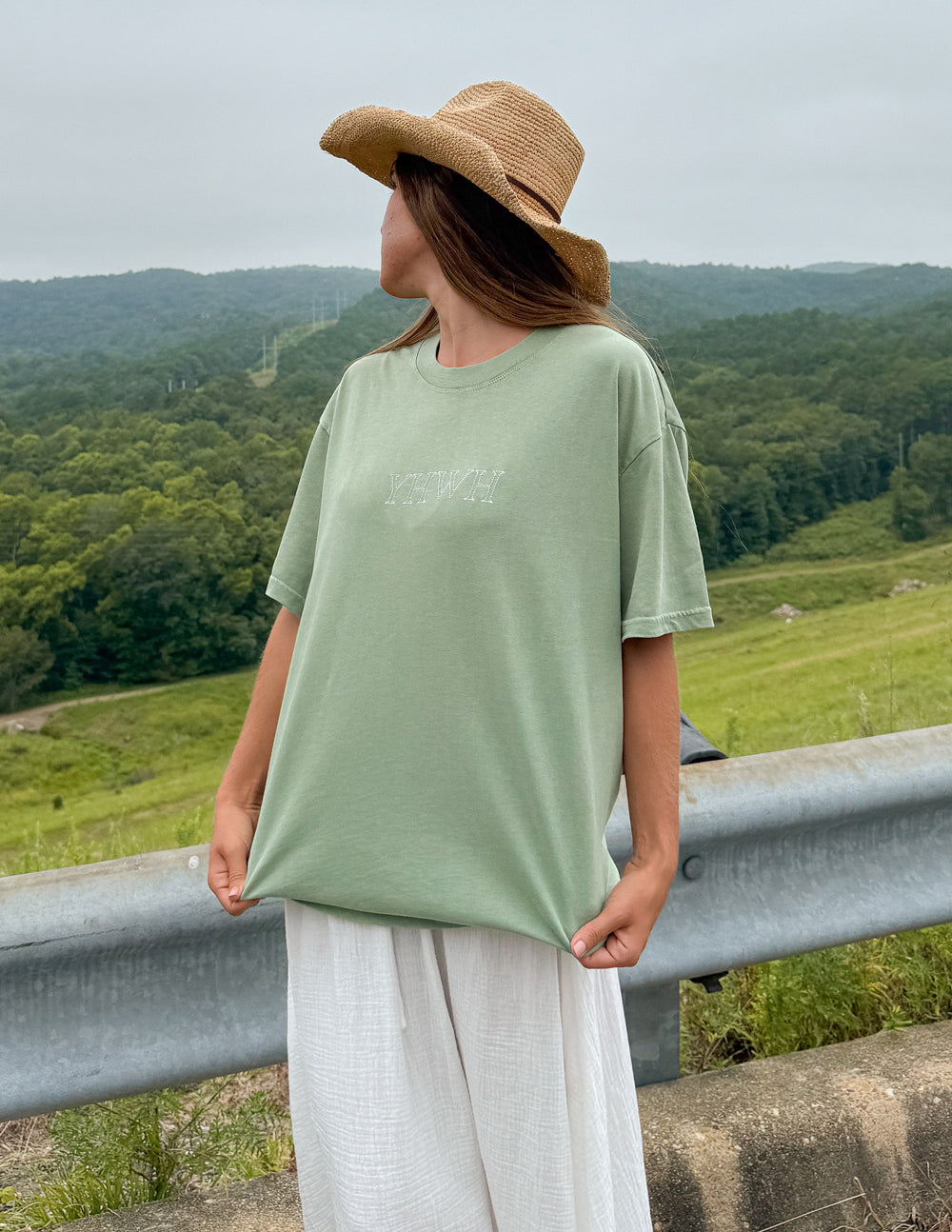 Unisex sage green T-shirt with small chest YHWH logo.