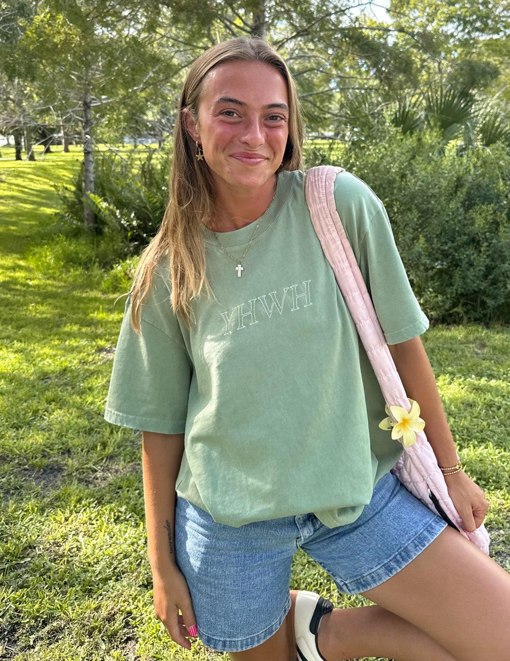 Unisex sage green T-shirt with front YHWH logo, relaxed fit.