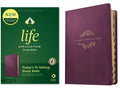 Purple leatherlike life application study Bible cover with floral emblem, indexed