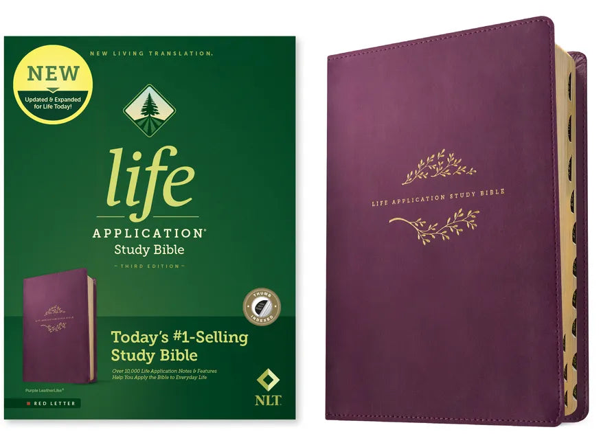 Purple leatherlike life application study Bible cover with floral emblem, indexed