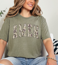 Olive camo graphic T-shirt with large AME N lettering on front