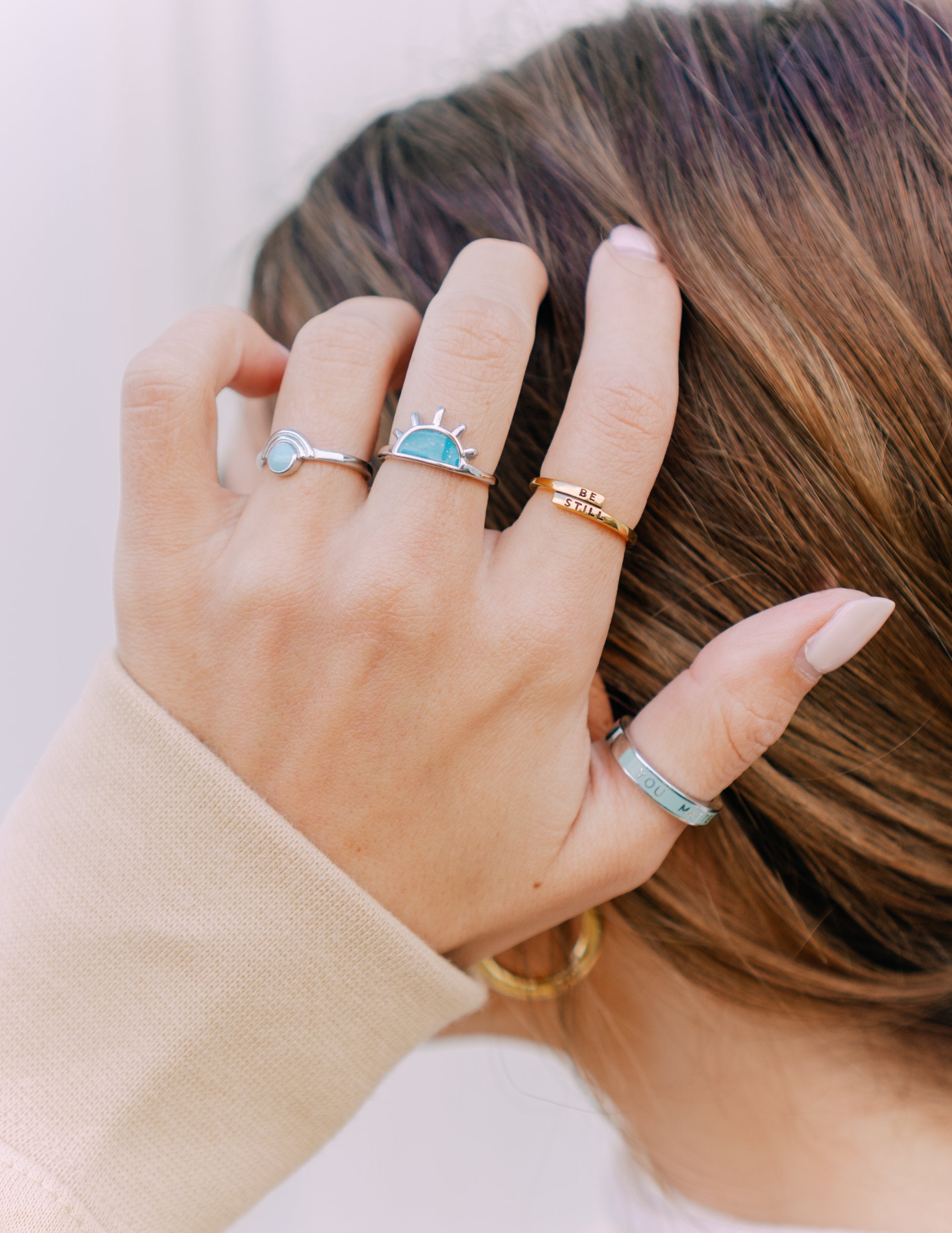 Gold tone ring with light blue enamel oval centerpiece